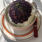 27597